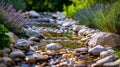 Tranquil garden stream with colorful stones and flowers