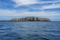 Tranquil island with crystal clear blue waters, set against a stunning backdrop of the sky in Mexico