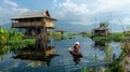 A tranquil lake in Asia, with a stilt house and rower. Generative AI