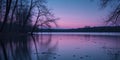 Tranquil Lake at Dusk with Bare Trees and Reflections Royalty Free Stock Photo