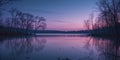 Tranquil Lake at Dusk with Bare Trees and Reflections. Royalty Free Stock Photo