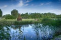 Tranquil lake with large ready built bonfire Royalty Free Stock Photo