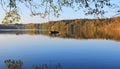 Tranquil lake with lonely rowing boat Royalty Free Stock Photo