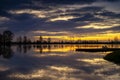 Tranquil Lake Reflecting A Vivid Orange Sunset