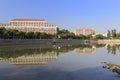 Tranquil lake with reflection of trees and houses