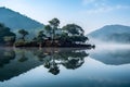 Tranquil lake with a rural house and trees on the shore surrounded by mountains. AI-generated. Royalty Free Stock Photo