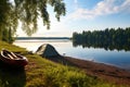 tranquil lakeside camping site with a lone canoe