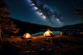 A tranquil lakeside campsite with a campfire, tents, and a clear night sky full of stars for stargazing