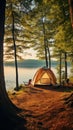 Tranquil lakeside campsite with cozy tent pitched under tall trees and reflective water surface