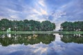 Tranquil landscape with a canal, trees, blue sky and dramatic clouds, Tilburg, Netherlands Royalty Free Stock Photo