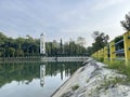 Landscape at a lake with sky, clouds and trees reflection on the water Royalty Free Stock Photo