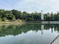 Landscape at a lake with sky, clouds and trees reflection on the water Royalty Free Stock Photo