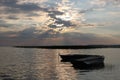 Tranquil landscape with two row boats on the background of sunset Royalty Free Stock Photo