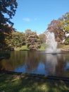 Tranquil landscape of a water fountain in a pond in a park in Riga, Latvia Royalty Free Stock Photo