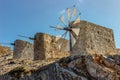 Tranquil Lassithi Plateau famous for old stone windmills,Crete,Greece.Abandoned iconic windmills surrounded by wild rocky peaks. Royalty Free Stock Photo
