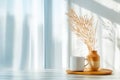Tranquil morning scene with coffee mug and pampas grass by window Royalty Free Stock Photo