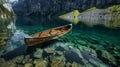 Tranquil mountain lake with clear canoe showcasing underwater stones and mirrored cliffs Royalty Free Stock Photo