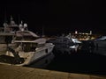 Tranquil night view of moored luxury yacht boats at marina Vieux Port de Cannes at the French Riviera. Royalty Free Stock Photo