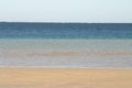 Tranquil ocean scene with sandy beach