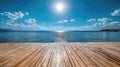 Tranquil ocean view with sunlit wooden dock and clear blue sky Royalty Free Stock Photo