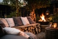 a tranquil outdoor seating area with cushions around a bonfire