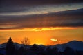 Tranquil panoramia scene of red sun and orange sky sunset over the Rocky Mountains in Colorado by Denver Royalty Free Stock Photo