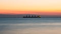 Tranquil Peaceful Scenery of Sea and big ship after Sunset, wit Royalty Free Stock Photo