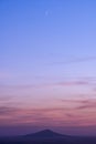 Calm soft pink sunset over the mountain range