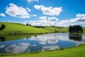 Tranquil pond nestled amidst rolling green hills. Generative AI