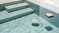 Serene Pool Scene with Floating Objects Royalty Free Stock Photo