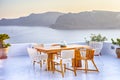 Tranquil and Romantic Atmosphere at Open Air Terrace Restaurant in Beautiful Oia Village on Santorini Island in Greece in Front of Royalty Free Stock Photo