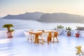 Tranquil and Romantic Atmosphere at Open Air Terrace Restaurant in Beautiful Oia Village on Santorini Island in Greece in Front of Royalty Free Stock Photo