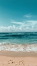 Tranquil sandy beach scene with gentle waves, serene ocean view Royalty Free Stock Photo