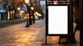 A tranquil scene at dusk, an empty bus stop poster display illuminated by warm lights, surrounded by urban trees Royalty Free Stock Photo