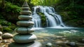 Zen Stone Stack by Serene Waterfall in Lush Forest, Balancing Rocks, Peaceful Nature Royalty Free Stock Photo