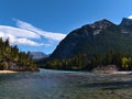 Tranquil scene with flowing Bow River near Banff, Banff National Park, Alberta, Canada in the Rocky Mountains on sunny day. Royalty Free Stock Photo