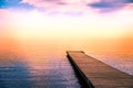 Tranquil scene of a pier in the sea with fog Royalty Free Stock Photo