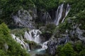 Tranquil scene of the Plitvice Lakes in Croatia with waterfalls surrounded by lush green foliage Royalty Free Stock Photo