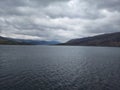 Tranquil Scene: Serene Landscape with Mountain, Lake, and Overcast Sky a view from uk Royalty Free Stock Photo