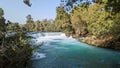 Tranquil scene of a small waterfall cascading over rocks surrounded by trees in Turkey Royalty Free Stock Photo