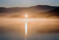 Sunrise Serenade: Misty Lake at Dawn Royalty Free Stock Photo