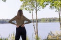 Contemplative Woman Overlooking a Serene Lake Royalty Free Stock Photo