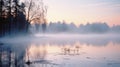 Tranquil scenery of lake and mist at dawn