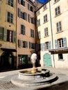 Tranquil stone fountain in an ancient courtyard in Toulon, France