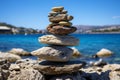 Tranquil stone stack on ocean, highlighting interplay of light and shadow for serene image Royalty Free Stock Photo