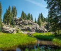 Tranquil stream passes by a picturesque cluster of boulders along the Jemez River New Mexico