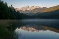 Tranquil sunrise illuminates the serene beauty of the lake