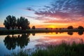 a tranquil sunrise over a calm countryside pond