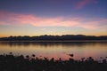 Tranquil Sunrise over Calm Lake Royalty Free Stock Photo