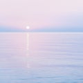 Tranquil sunrise or sunset over sea ocean calm waters
